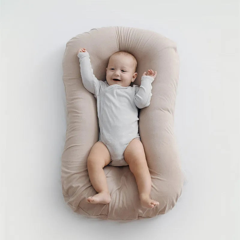 Portable baby nest crib measuring 75x45cm in cotton fabric with PP cotton filler