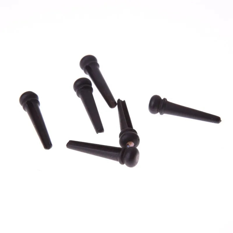 Six matt black ebony guitar string nails for folk acoustic guitars