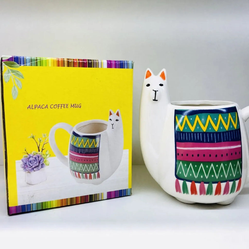 White ceramic mug with handle featuring a cartoon alpaca pattern on the side