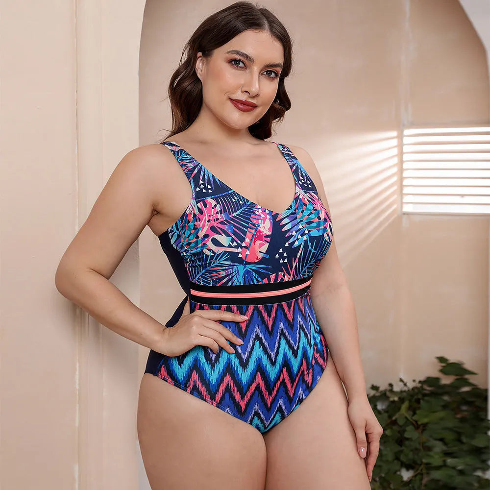 Women's blue printed one-piece swimsuit with spaghetti straps and a striped vest style.