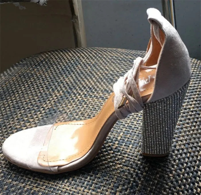 Women's black and gold pointed toe high heel shoes with plastic construction