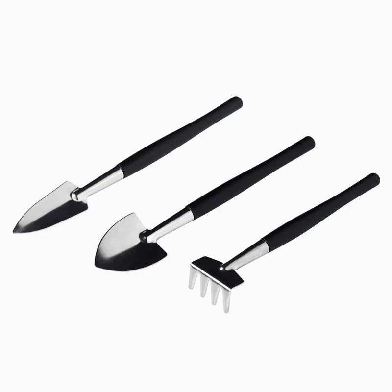 16-piece black succulent plant tools set showing scissors, tweezers, shovel, watering bottles, and gardening tools on work cushion