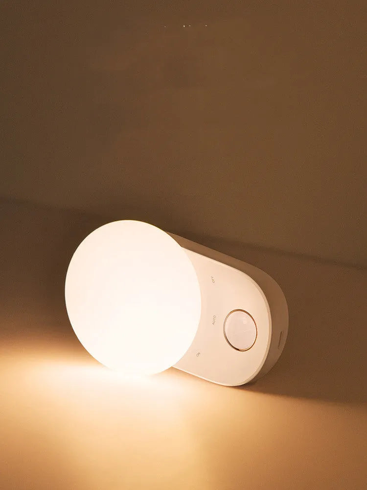 Baseus white rechargeable LED night light with motion sensor for bedroom bedside.