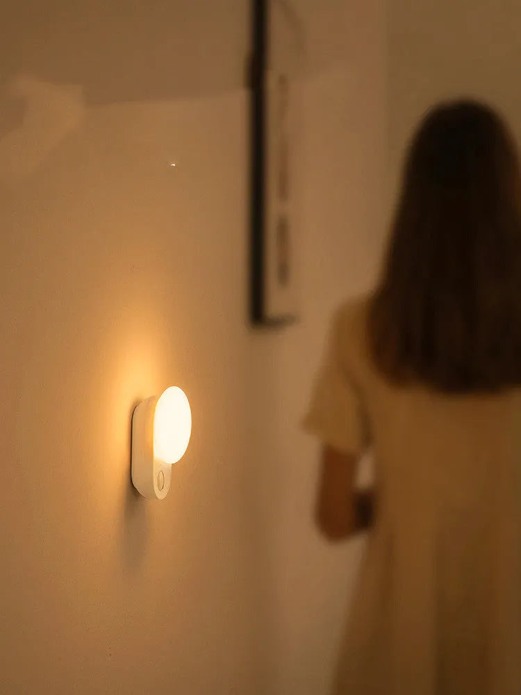 Baseus white rechargeable LED night light with motion sensor for bedroom bedside.