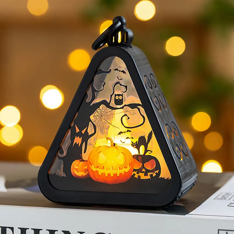 Halloween pumpkin lamp decoration prop in plastic and glass, showing one of four available colour designs.
