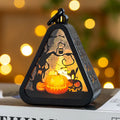 Halloween pumpkin lamp decoration prop in plastic and glass, showing one of four available colour designs.