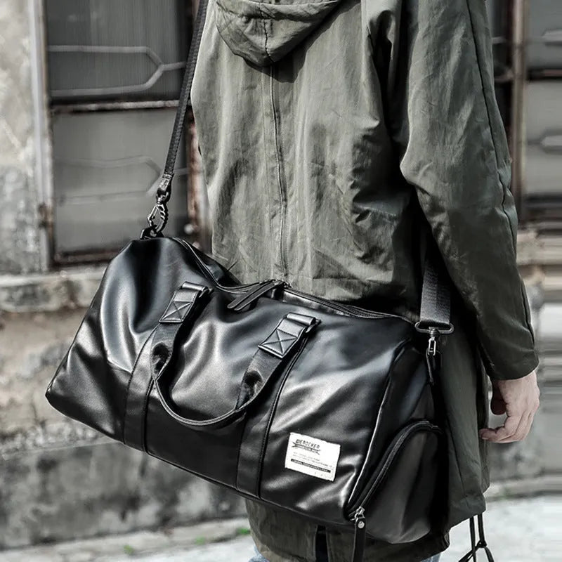 Black waterproof PU leather large capacity sports training bag showing internal computer and camera pockets