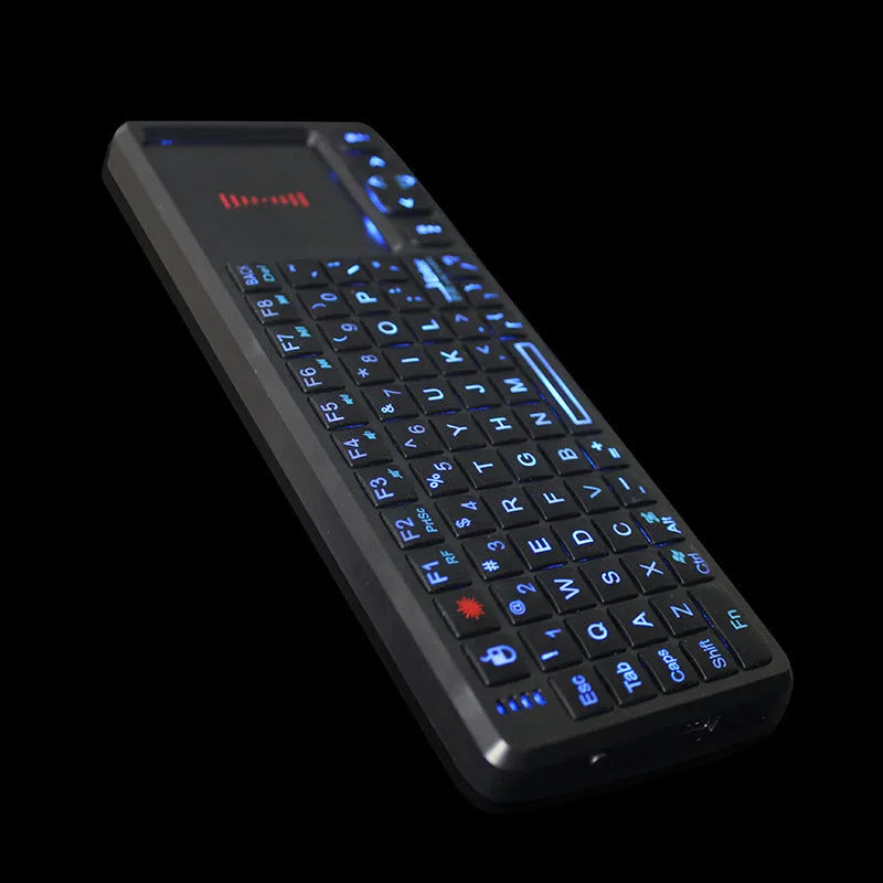 Black wireless mini keyboard with integrated touch screen and laser pointer for teaching presentations.
