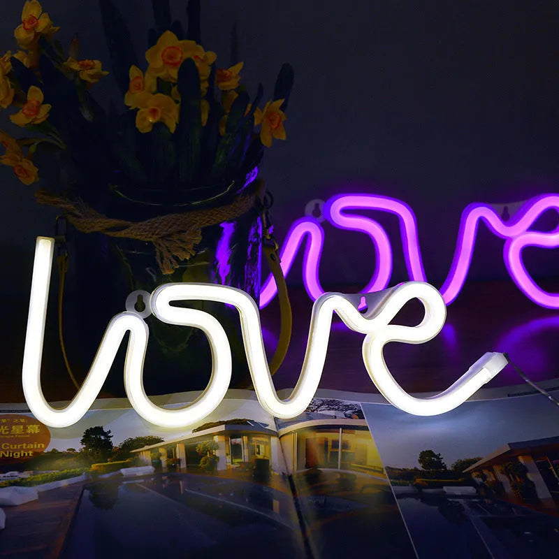 Pink LED neon sign light with silicone shell, powered by battery or USB for wedding table decorations.