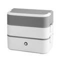 Double-layer portable heated lunch box with stainless steel interior and push-button controls