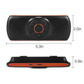 Orange plastic Bluetooth car hands-free speaker unit designed for sun visor mounting.