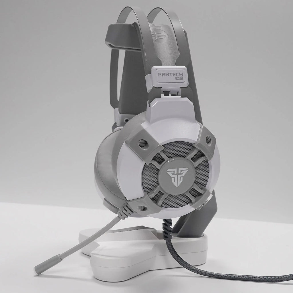 Black FANTECH HG11 USB gaming headset with large earcups, an adjustable microphone, and RGB lighting on the sides.