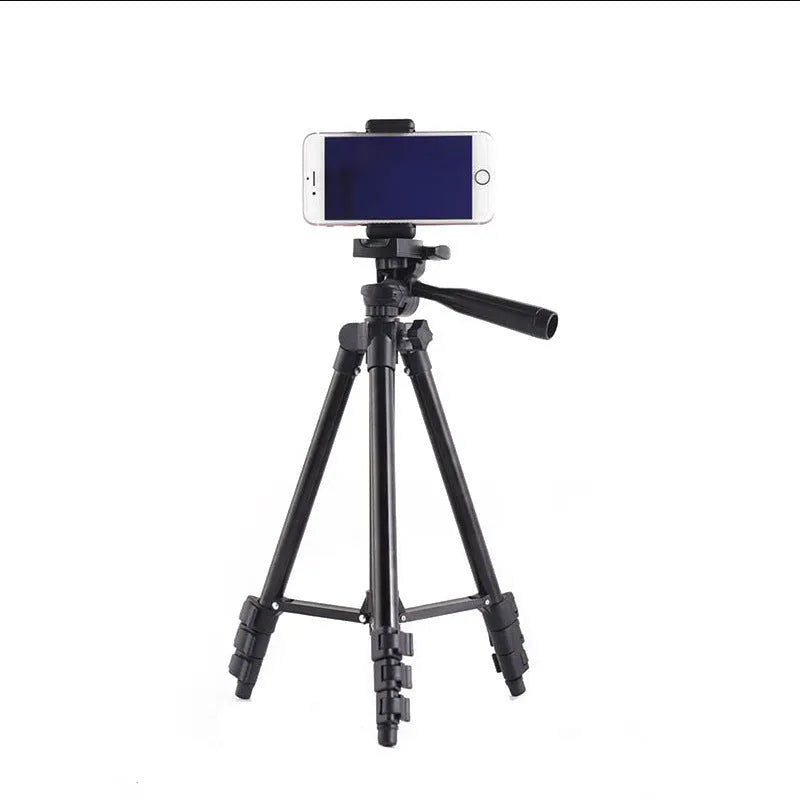 Black aluminium alloy camera tripod with four sections and a 3D head, shown fully extended.