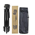 Black aluminium alloy camera tripod with four sections and a 3D head, shown fully extended.