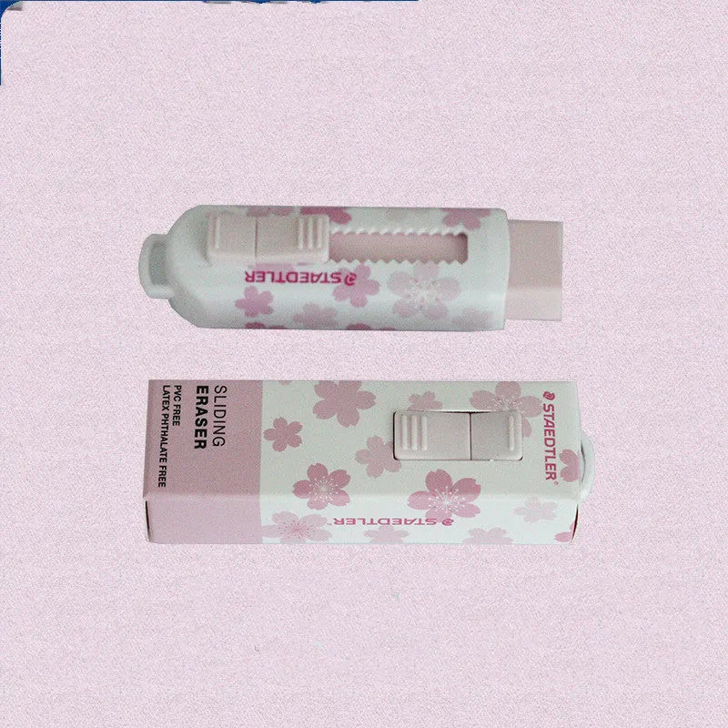 Square pink push-pull rubber eraser with replaceable core, shown next to a pencil for scale.