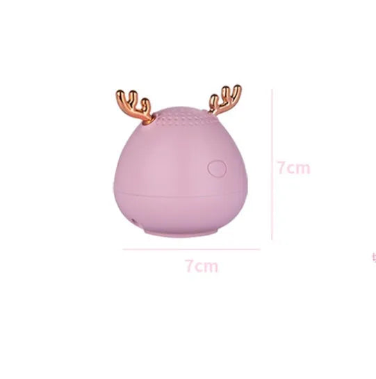 Compact Bluetooth wireless speaker in green colour with USB charging cable