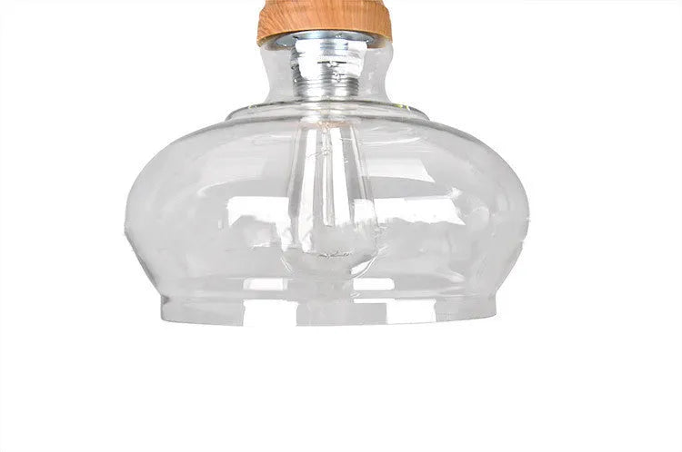Glass single head pendant light with wood grain finish and adjustable height mechanism
