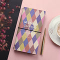 Simple soft-cover TN hand book notebook open on a page, showing five colour options A through E.