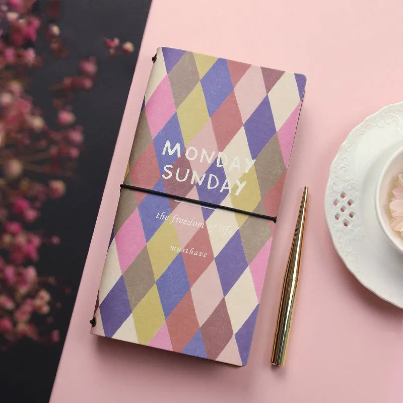 Simple soft-cover TN hand book notebook open on a page, showing five colour options A through E.