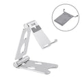 Folding metal phone holder in black on a desk with a mobile phone propped up for hands-free viewing