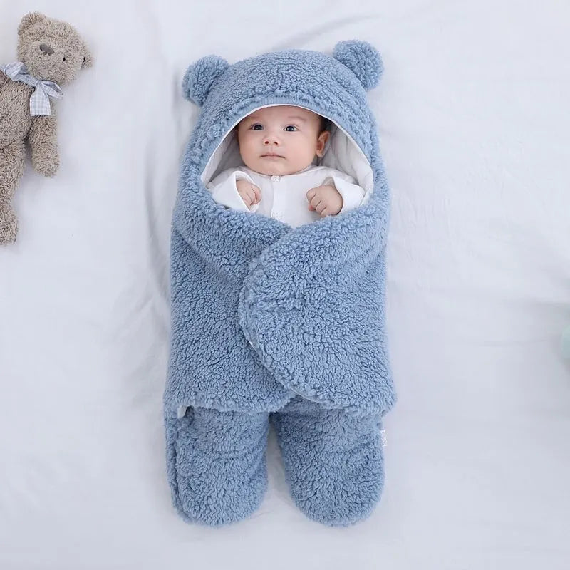 Cotton blend baby quilted sleeping bag wrapper shown in light blue colour