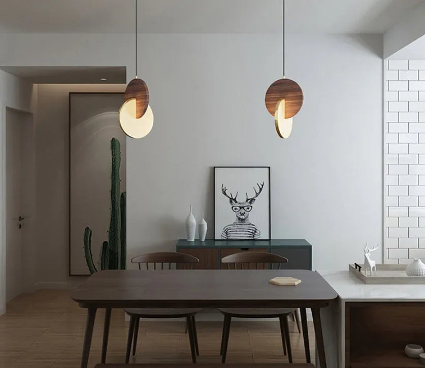 Long-line walnut wood wall chandelier with carved detailing and warm white LED lighting