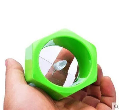 Yellow and green ABS plastic vegetable cutter with spiral mechanism for slicing cucumbers