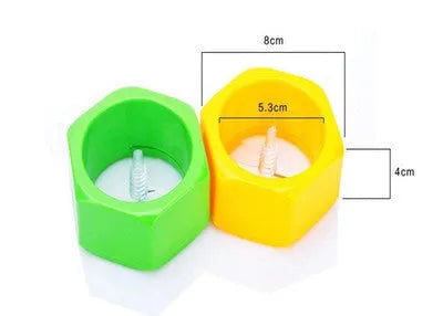 Yellow and green ABS plastic vegetable cutter with spiral mechanism for slicing cucumbers