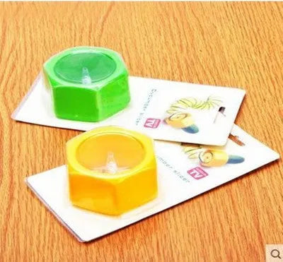Yellow and green ABS plastic vegetable cutter with spiral mechanism for slicing cucumbers