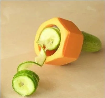 Yellow and green ABS plastic vegetable cutter with spiral mechanism for slicing cucumbers