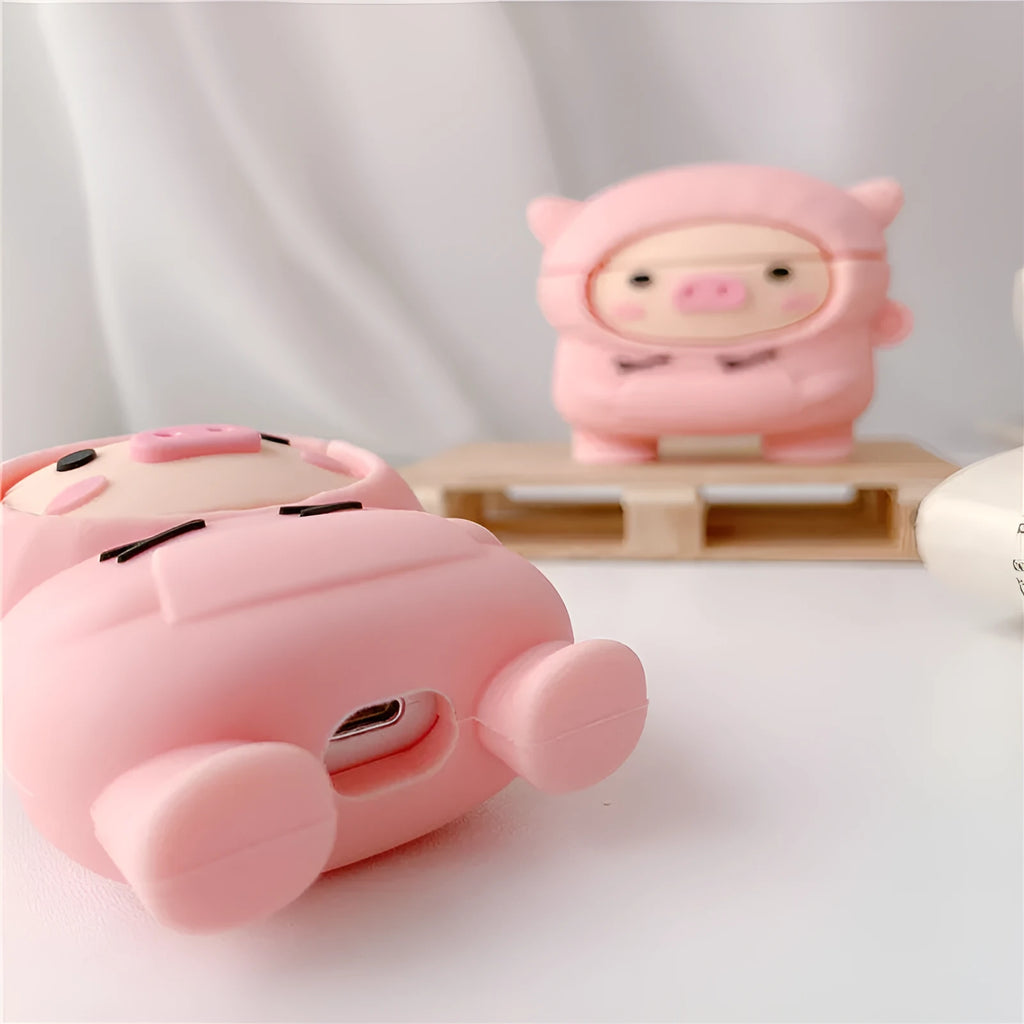 Pink silicone flip case for AirPods with cartoon pig design and a metal hook.
