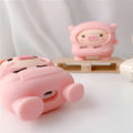 Pink silicone flip case for AirPods with cartoon pig design and a metal hook.