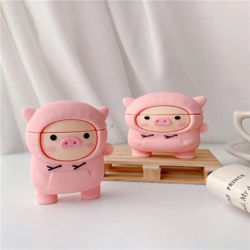 Pink silicone flip case for AirPods with cartoon pig design and a metal hook.