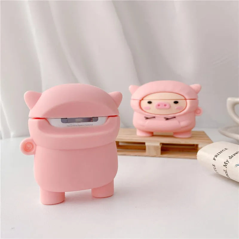 Pink silicone flip case for AirPods with cartoon pig design and a metal hook.
