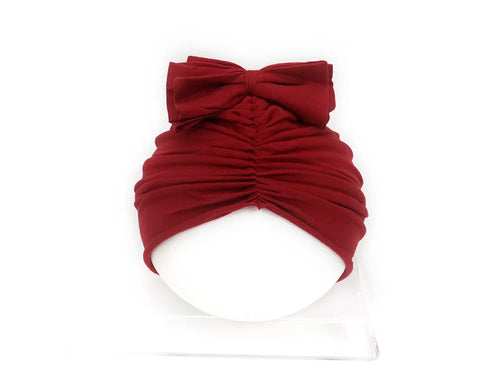 Soft knitted acrylic baby girl hat in turban style for infants 0-28 months in various candy colours
