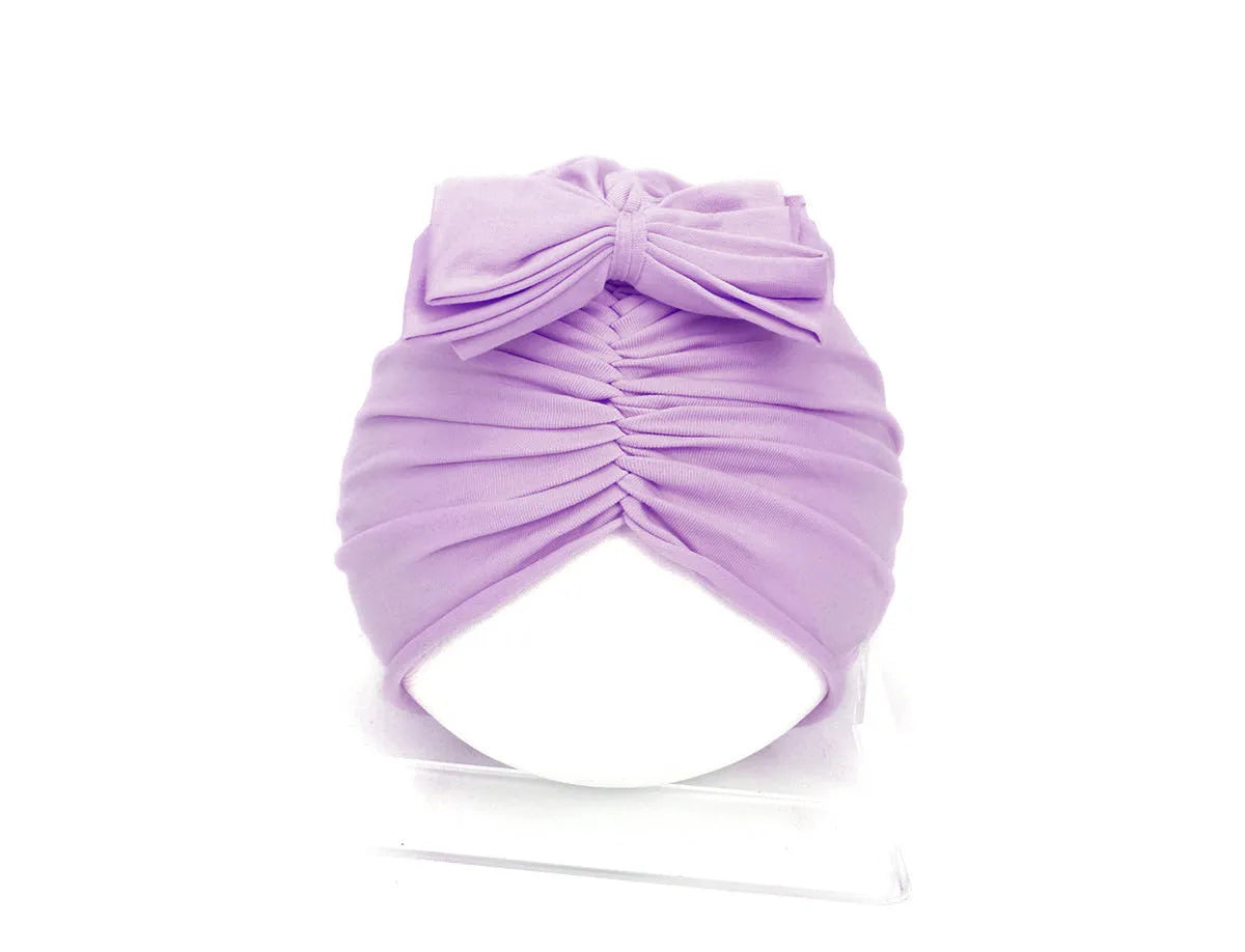 Soft knitted acrylic baby girl hat in turban style for infants 0-28 months in various candy colours