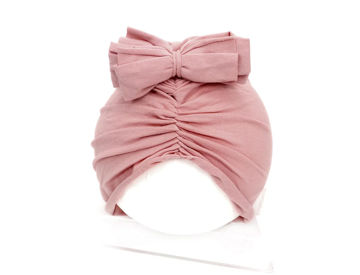 Soft knitted acrylic baby girl hat in turban style for infants 0-28 months in various candy colours