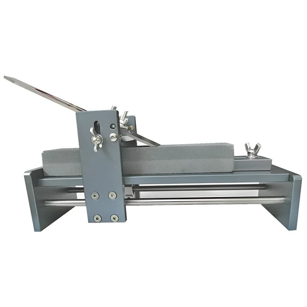 Fixed angle sharpening tool for woodworking planers and chisels on a workbench.
