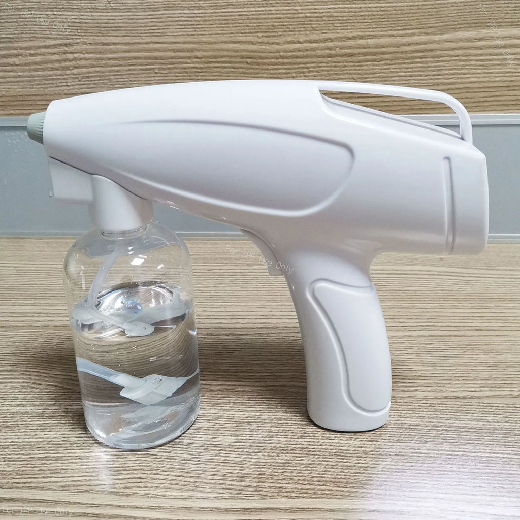 White handheld wireless electric spray disinfection gun with USB charging port