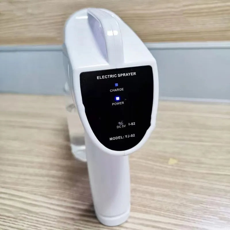 White handheld wireless electric spray disinfection gun with USB charging port