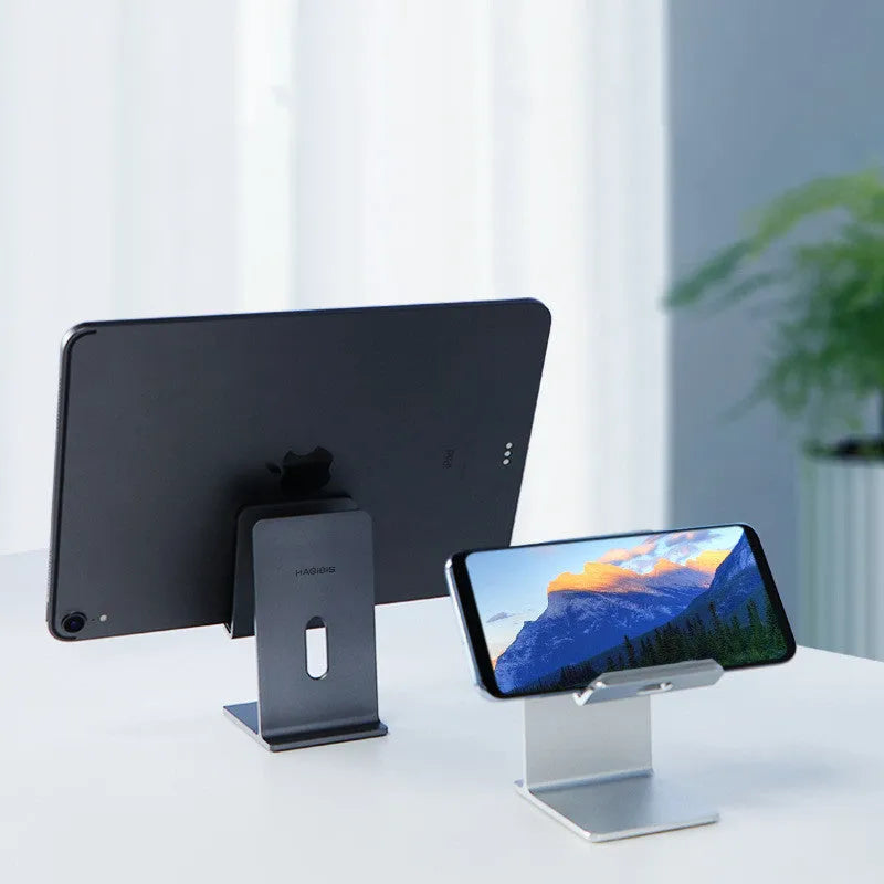 Alloy universal mobile phone holder for smartphones and tablets on desktop in dark space grey colour