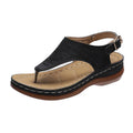 Women's wedge heel flip flop sandals with an adjustable back buckle strap in black.