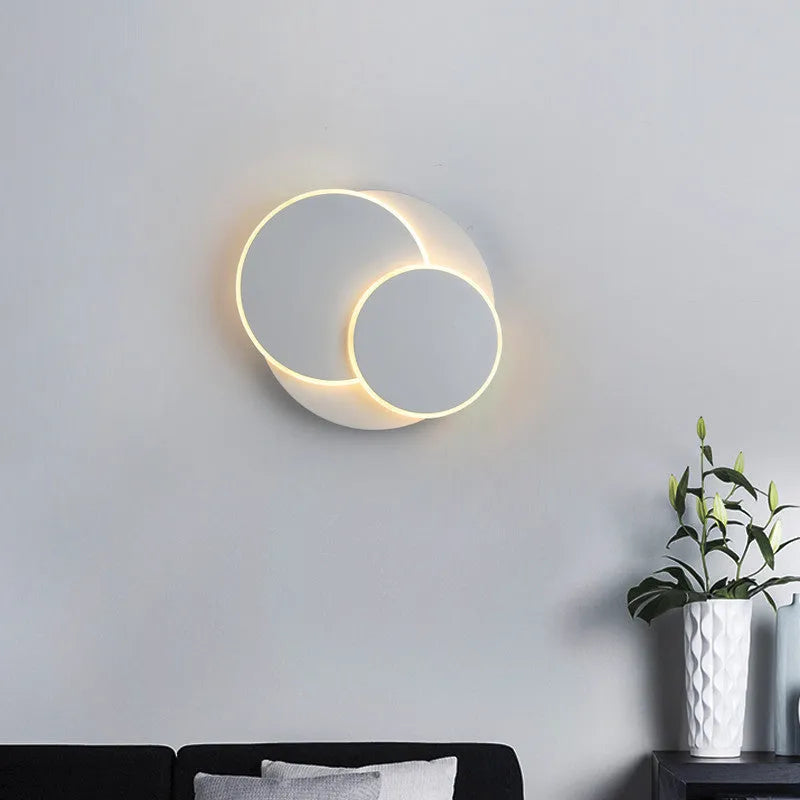 Modern round wall lamp in black or white with acrylic shade, shown in three sizes: 22cm, 18cm, and 14cm diameter.