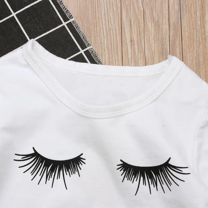 Pudcoco white girl set with eyelash short sleeve top and ripped trousers on child model