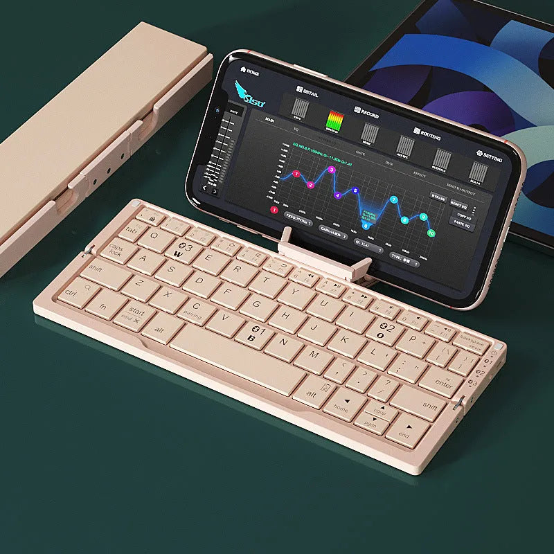 Silver white foldable Bluetooth keyboard open with tablet on stand and closed for pocket storage