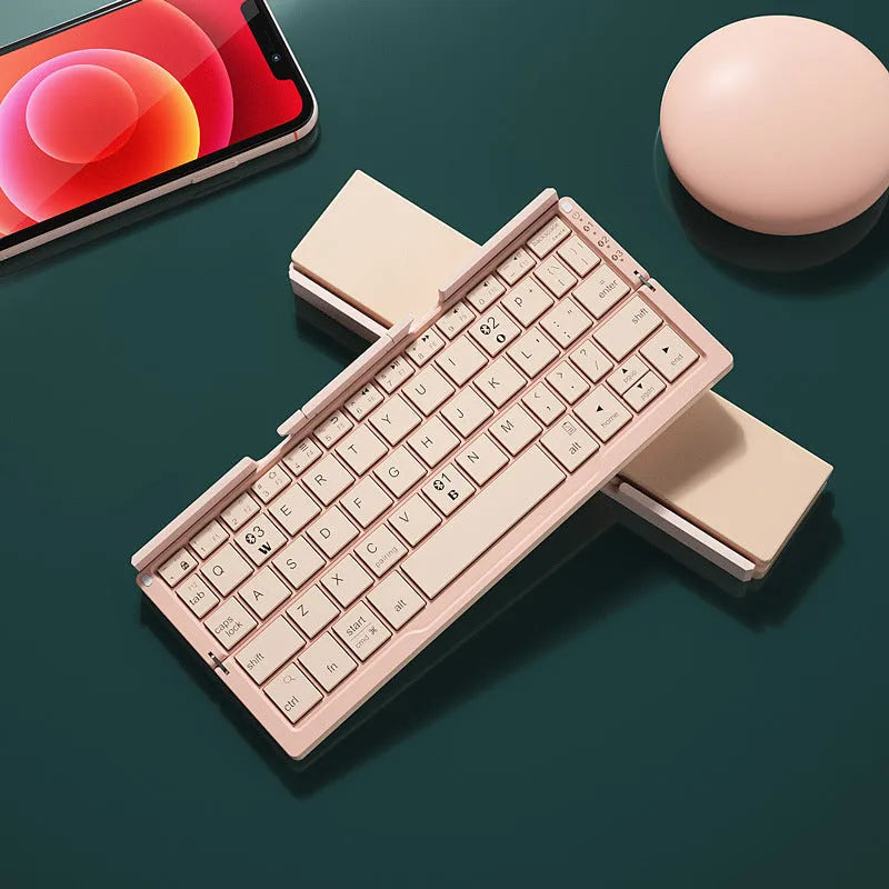 Silver white foldable Bluetooth keyboard open with tablet on stand and closed for pocket storage