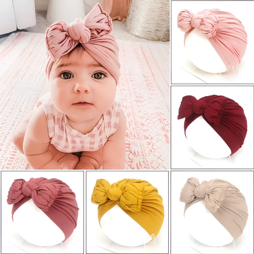 Soft knitted acrylic baby girl hat in turban style for infants 0-28 months in various candy colours