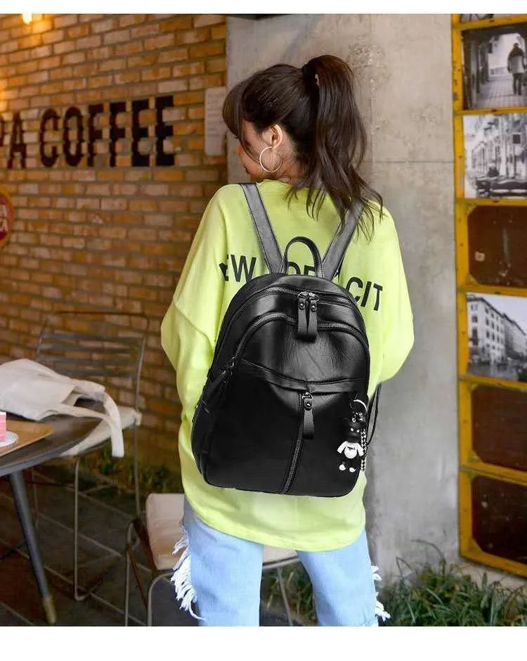 Black soft PU leather backpack with large 35L capacity and double straps