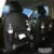 PU leather car storage hanging bag with multiple pockets attached to car seat back