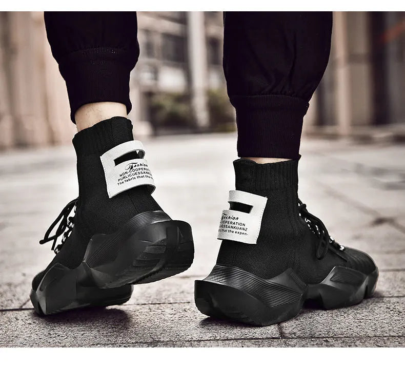 Men's black and white casual sports shoes with mesh lining, shown in large sizes.